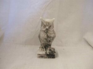 Statuette of an owl on a book