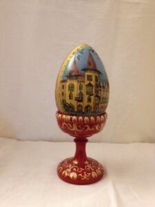 Painted wooden egg with stand