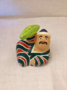 Figurine of a reclining man