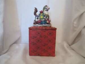 Gift box containing a statue of a horse