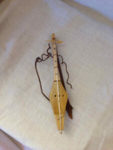 Miniature wooden musical instrument