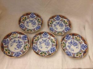 Set of five small ceramic plates