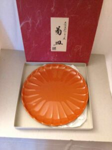 Lacquered plate