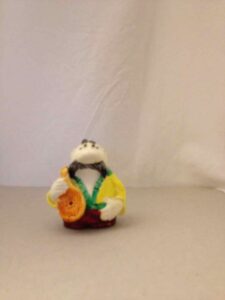 Figurine of a man holding a mandolin