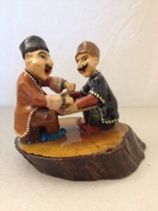 Seated figurines playing chess