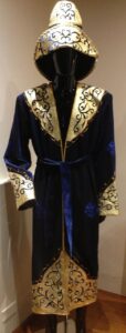 Blue cloak (shapan) and hat (aiyr kalpak)