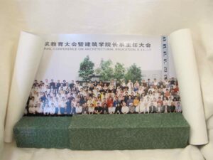 Color photograph  rolled up in green box