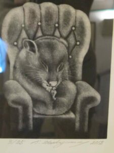 Framed engraving of a mouse in a chair