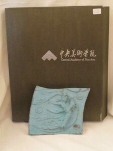 Bronze plaque in a box