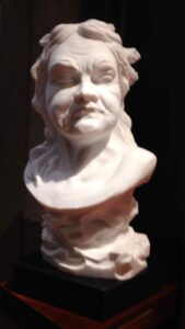 Marble bust of The old woman that jumps with the pole (La vecchia che salta con lasta)