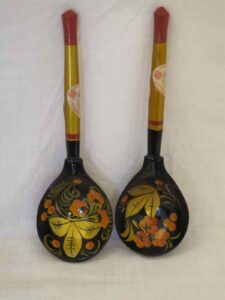 Four lacquered wooden spoons