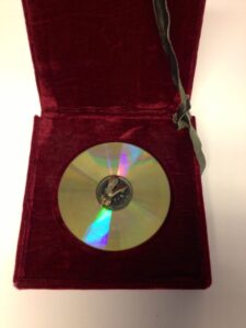 CD with metal fly