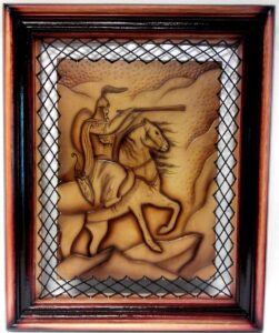 Framed  leather panel with image of a knight on a horse