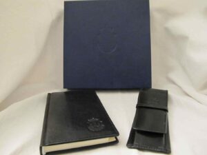 Set of a leather bound address book and matching pen and pencil case in a gift box
