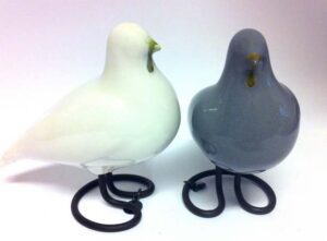 Two ceramic pigeons